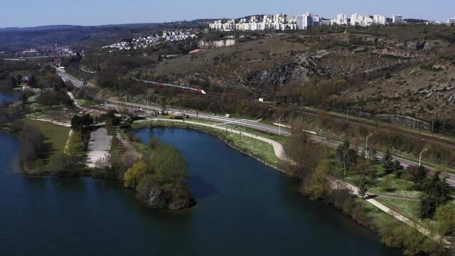 Train in Europe near lake (4k 30p Drone)