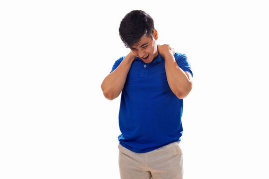 Portrait of young man suffering from shoulder pain 