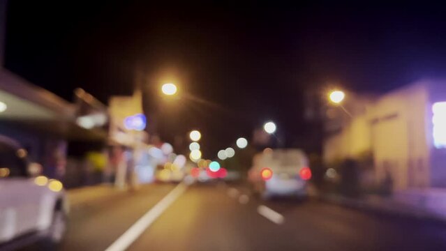 Traffic at night on bokeh light glitter  effects background.