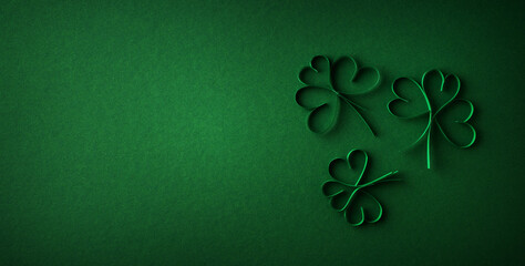 Saint Patrick day flat lay concept with shamrock clover on green background