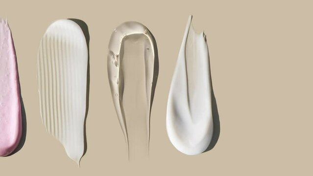 cosmetic smears cream texture on pastel background