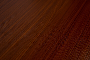 Reddish brown wood grain background.