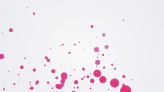 Pink inks drops on white background.
