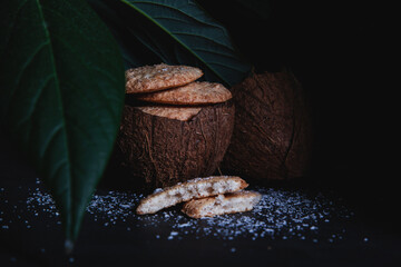 Coconut chip cookies on a dark background
