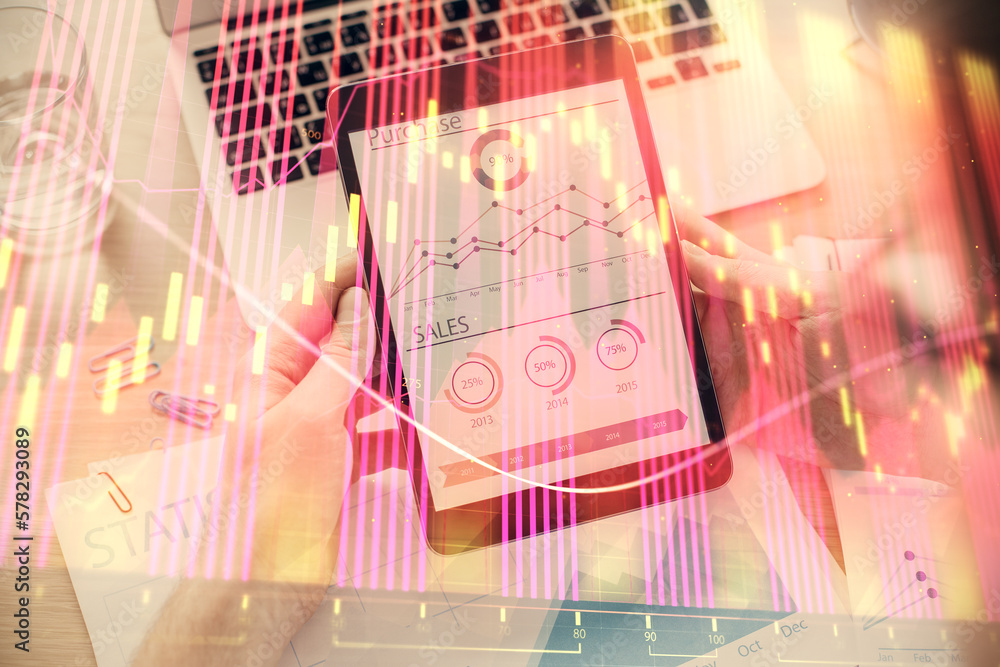 Aufkleber double exposure of man's hands holding and using a digital device and forex graph drawing. financial