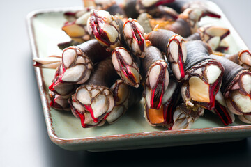 Fototapeta na wymiar Barnacles, goose neck barnacle, percebes, gallician barnacles in a plate, close-up. Pollicipes pollicipes. Expensive delicatessen, gourmet sea food.