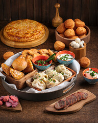 Set of assorted oriental cuisine dishes with samsa and manti