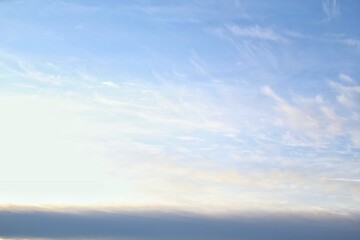White light soft clouds floating in blue sky. Nature morning landscape background. Clear spring wind. Bright summer day. Winter calm air skyscape. Abstract panorama. Change climate. Low angle view
