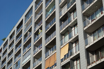 Modern residential building with balconies. Real estate and housing issues concept.
