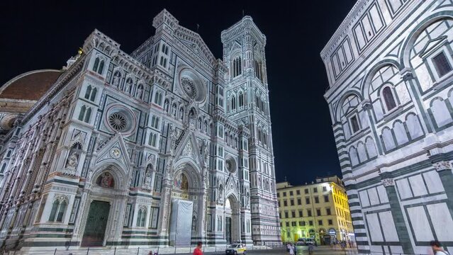The front view of The Basilica di Santa Maria del Fiore night timelapse hyperlapse which is the cathedral church (Duomo) of Florence in Italy. Evening illumination. Bell tower and dome