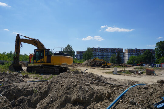 Yellow excavator on construction site