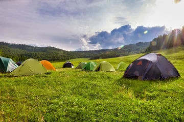Kussenhoes Tourist tent in the camp among the meadows in the mountains. Outdoor camping with beautiful sunshine in the morning © Aleksandr
