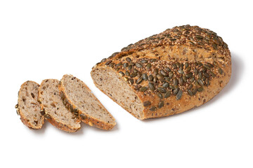 Fresh loaf and slices of spelt bread with a variety of seeds close up isolated on  white background