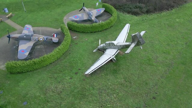 Aerial view descending to Capel-Le-Ferne down two earth Battle of Britain memorial garden stainless steel aircraft