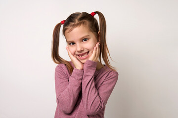 Cute smiling preschool girl portrait on white background