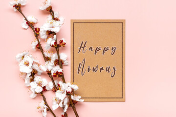 Sprigs of the apricot tree with flowers on pink background Text Happy Nowruz Holiday Concept of spring came Top view Flat lay Hello march, persian new year - 578307035