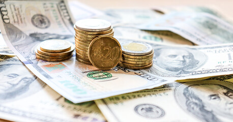 Dollar bills laid out on table. Three different columns of coins, 20 cents coin, financial crisis,...