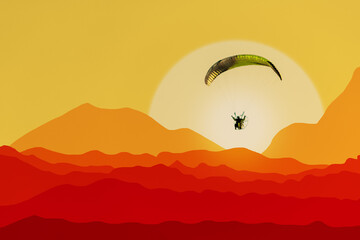 One paraglider flies in the sky at sunset over the desert.
