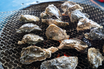 Grilled fresh oyster in Taiwan, famous street food.