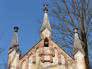 Close-up photo of a church steeple and towers of a lovely St. Joseph Chapel, Novi Dvori complex in...