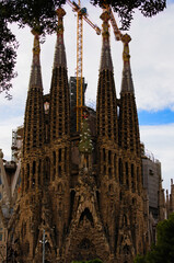 Fototapeta na wymiar Barcelona, Spain-January 03,2016:Scenic landscape view of famous La Sagrada Familia. Impressive cathedral designed by architect Gaudi, which is start building in march 1882. Travel and tourism concept