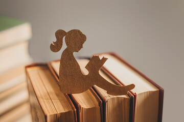 Silhouette of a girl reading a fairy tale. Child psychology
