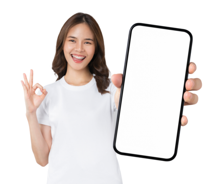 Beautiful Asian woman holding smartphone mockup of blank screen and shows ok sign on grey background.