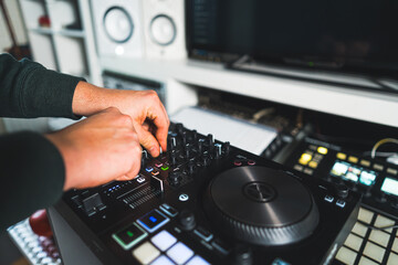 Fototapeta premium closeup shot of the musician mixing sound on his electronic device, music concept. High quality photo