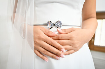 Gorgeous, bride in white luxury dress is getting ready for wedding. 