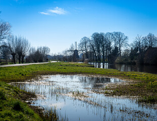 Windmill in dutch landscape