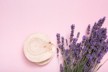 Podium, stage or pedestal with lavender flowers top view. Mock up for cosmetic products .
