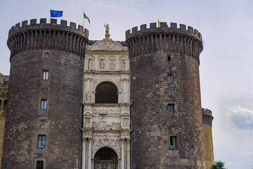 Naples, Italy Castel Nuovo facade with triumphal arch and gatehouse. External day view of 13th...