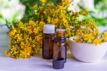 St. John's wort essential oil in a small bottle. Selective focus.