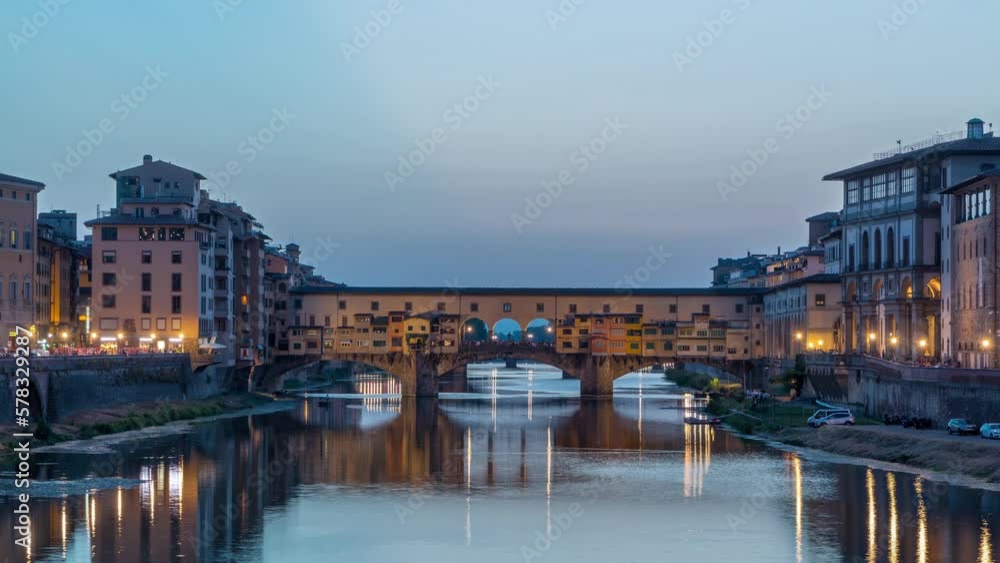 Wall mural river arno and famous bridge ponte vecchio day to night transition timelapse from ponte alle grazie 