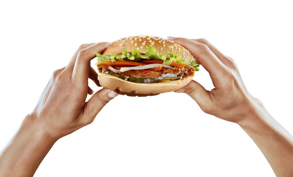 Fast food and diet. Hands hold the hamburger on transparent background.