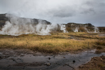 Iceland wild landscape with waterfalls and geysers in the autumn