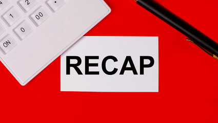 On a red background there is a white calculator, a pen and a white business card with the text RECAP