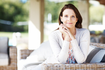 Fototapeta premium The image of serenity. An attractive woman having a relaxing time outdoors.