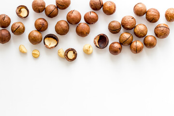 Raw macadamia nuts food. Healthy protein snack background - obrazy, fototapety, plakaty