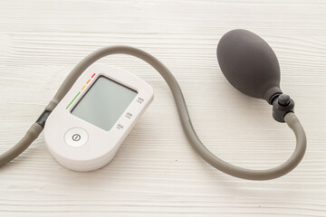 Blood pressure monitor or tonometer on doctor cardiologist table desk