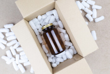 Eco package of parcels and biodegradable filler. Box is filled with a filler that does not harm the environment. Delivery of goods, parcels, delivery service, nature protection.  Recycling