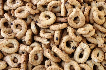 close up image of a pile of handmade artisanal taralli, a typical baked product of southern Italy