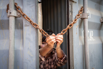 Woman trapped in cargo container wait for Human Trafficking or foreigh workers, Woman holding...