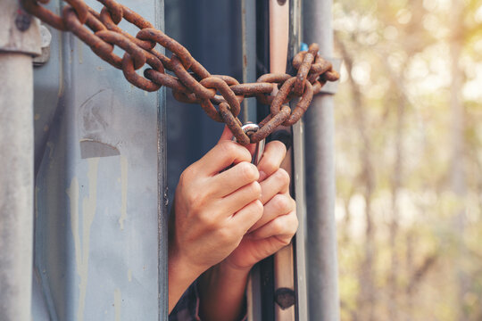 Woman trapped in cargo container wait for Human Trafficking or foreigh workers, Woman holding master key wait for holp help, woman chained to her wrist