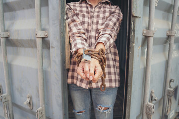 Woman trapped in cargo container wait for Human Trafficking or foreigh workers, Woman holding...