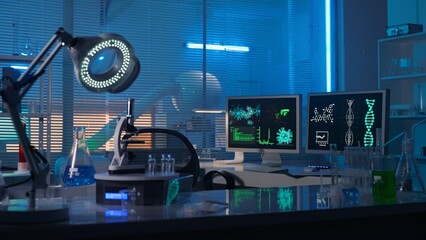 Modern medical research laboratory. Empty workplace of a scientist or researcher with computers, microscope, test tubes, flasks and magnifying lamp. Dark biochemical laboratory in the blue light.
