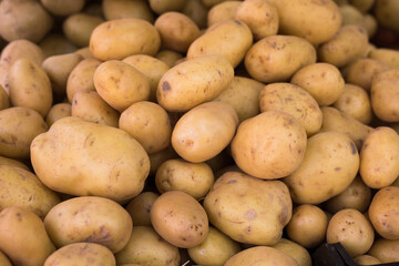 potatoes on counter in market