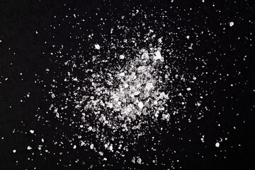Fototapeta premium Macro crystals of salt on a black background. Extra close up.