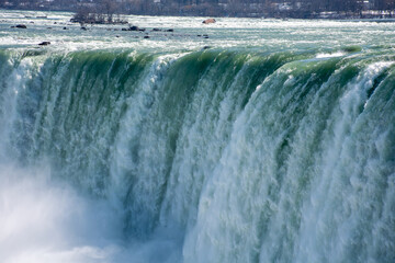 Stunning view of Niagara Falls in sunlight in Canada.