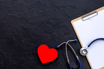Blue stethoscope and doctor clipboard. Male medical checkup concept